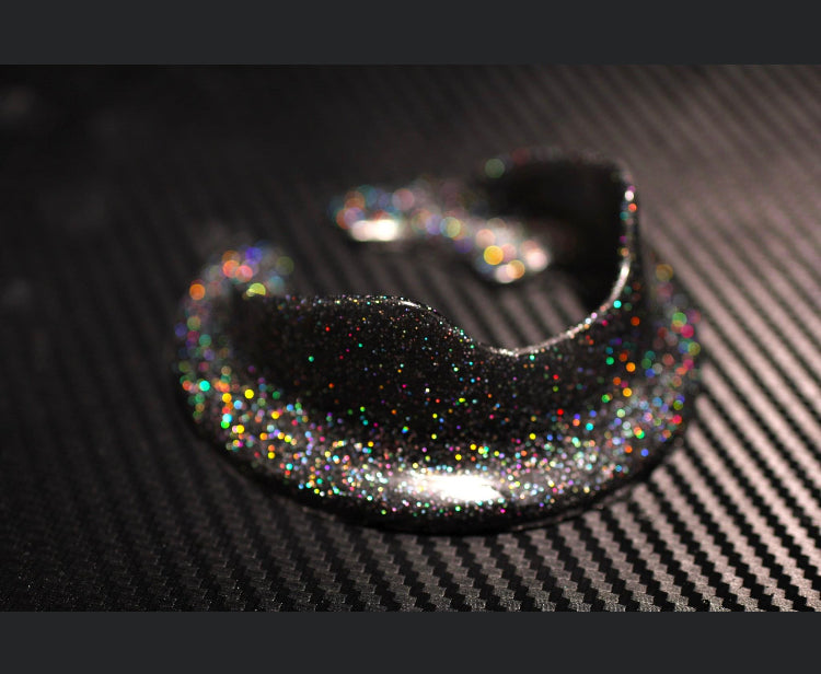 Multicolor holographic spec on black